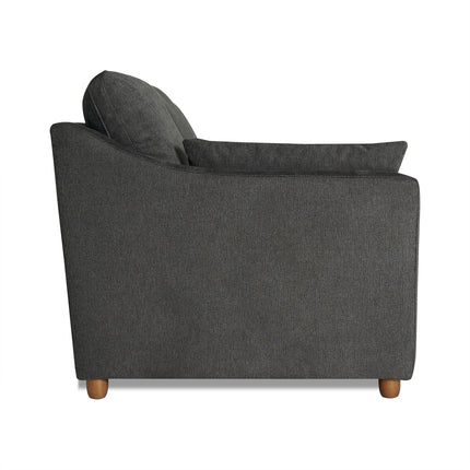 A side view of the My Cloud Slope Loveseat in dark gray reveals a cushioned backrest and armrests, supported by small wooden legs. The soft, textured fabric is perfect for modern or contemporary living rooms looking for customizable furniture solutions.