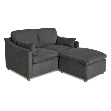 The My Cloud Slope Loveseat, in dark gray upholstery with square arms, features an accompanying matching ottoman on the right. Both pieces offer a plush look and stand on small wooden legs, combining style with durable furniture design.