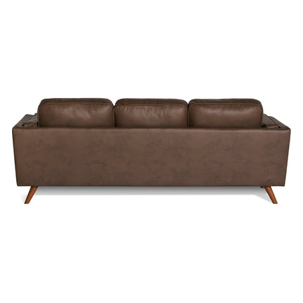 The Maddox Sofa features a back view of a brown leather design with three plush cushions and angled wooden legs, highlighting its mid-century modern style against a white background.