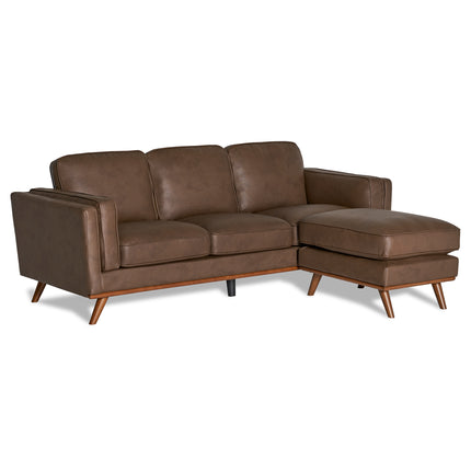 The Maddox Sofa is a brown leather sectional with a right-side chaise, plush back cushions, two armrests, and tapered wooden legs, all in an elegant mid-century modern design.
