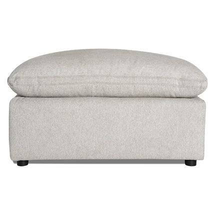 Meet the My Cloud 40 Ottoman, a comfy furniture piece in light gray with a plush cushioned top and minimalist black legs. Its soft, textured fabric enhances its modern and cozy look—perfect for any living space.