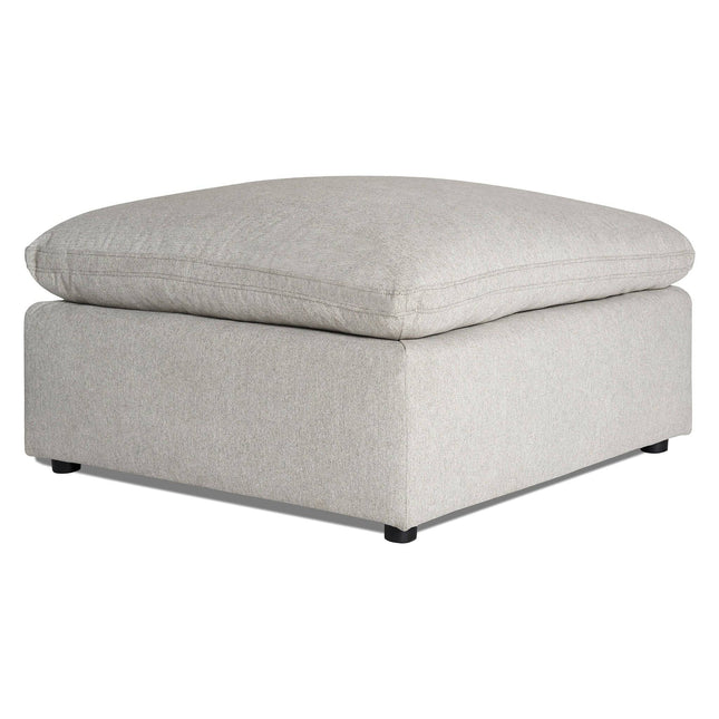 The My Cloud 40 Ottoman is a gray square piece with a cushioned top, solid base, and small black feet. Its soft fabric adds comfort and style to any room.