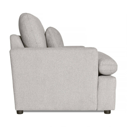 A side view of the My Cloud Loveseat reveals a modern, light gray upholstered armchair featuring thick cushions and armrests. Its boxy design with black legs provides customizable comfort and style against a plain white backdrop.