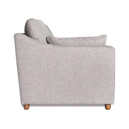 Side view of the My Cloud Slope Loveseat in light gray, featuring two seat and backrest cushions. Its minimalist design includes wooden legs, subtly textured fabric, slightly rounded armrests, and is part of the customizable collection for those valuing durable furniture.