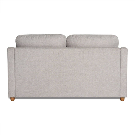 The My Cloud Slope Loveseat in gray features cushioned backrests, sleek lines, and wooden legs. Its soft fabric adds a minimalist touch. Part of our customizable furniture collection, it offers style and adaptability for any living space.