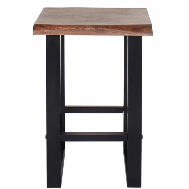 The Live Edge Stool boasts a dark brown, rectangular acacia wood top made from sustainable resources. Its minimalist design is enhanced by black metal legs with two crossbars for support, accentuating the natural grain and offering a simple, modern look.