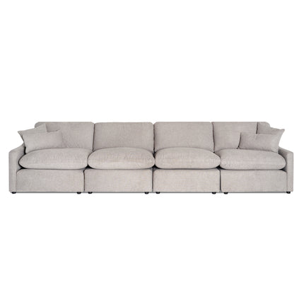 The My Cloud Slope 4 Piece Straight is a beige sectional sofa with a modern, minimalist design featuring four seats and matching cushions. Its soft fabric upholstery and rounded edges ensure exceptional comfort for any contemporary living space.