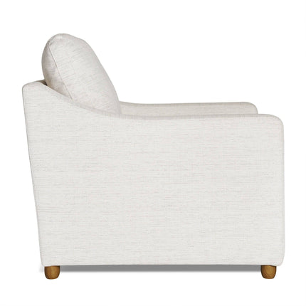 The My Cloud Slope Chair is a modern upholstered armchair in light beige fabric, featuring a high backrest and cushioned seat. It has a minimalist design with wooden legs and a slightly sloped back, providing added comfort.