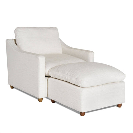 The My Cloud Slope Chair is a white, modern armchair with a matching cushioned ottoman. Part of our customizable collection, it features clean lines, wooden legs, and soft upholstery, making it comfortable for any living room or lounge area.