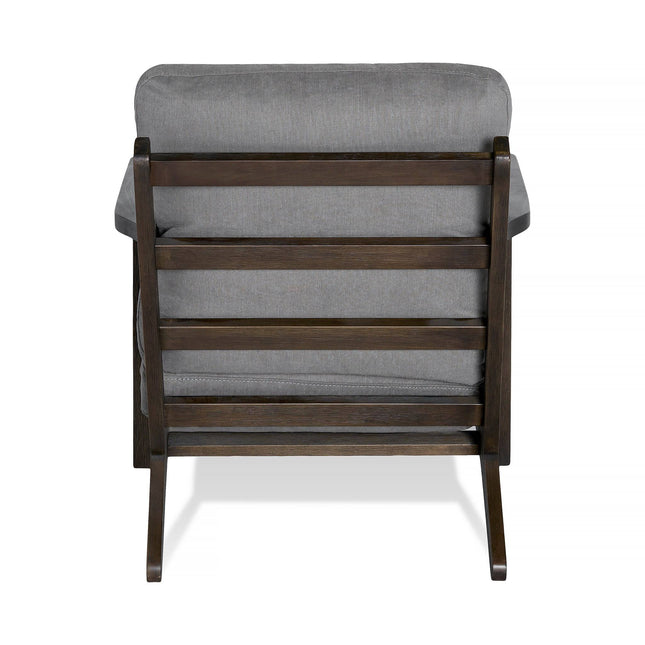 The Peyton Chair showcases a sleek rear view with dark brown slats and a cushioned backrest and seat upholstered in gray fabric. This mid-century style piece features a minimalist design with clean lines and a sturdy frame, perfectly blending elegance and comfort.