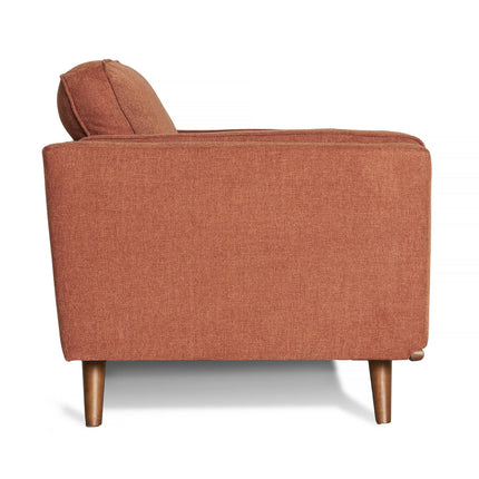 Side view of the Maddox Loveseat, a modern mid-century style piece in warm rust. This single-seater sofa features durable construction, cushioned backrest and arms, and tapered wooden legs. Textured fabric upholstery enhances its elegant design.