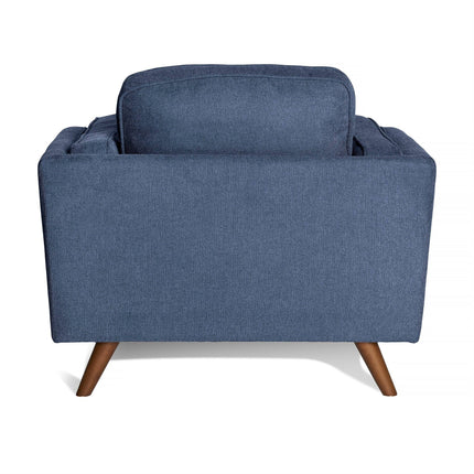 Rear view of the Maddox Chair featuring blue fabric upholstery, wooden legs, and plush cushions against a white background.