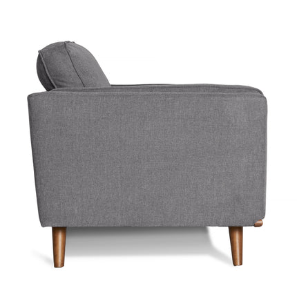 The Maddox Loveseat in modern grey fabric features a single seat cushion and two visible wooden legs, all set against a white background. Its durable rectangular design embodies mid-century modern elegance.