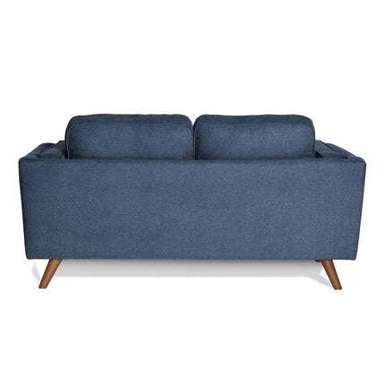 The Maddox Loveseat showcases a minimalist, mid-century modern design with its back view revealing a sleek dark blue finish, wooden legs, durable construction, and two back cushions.