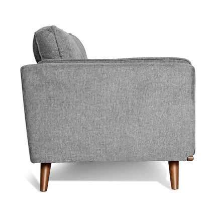 Side view of the Maddox Sofa, featuring gray upholstery and wooden legs in a mid-century modern style, set against a white background to emphasize its minimalist elegance.